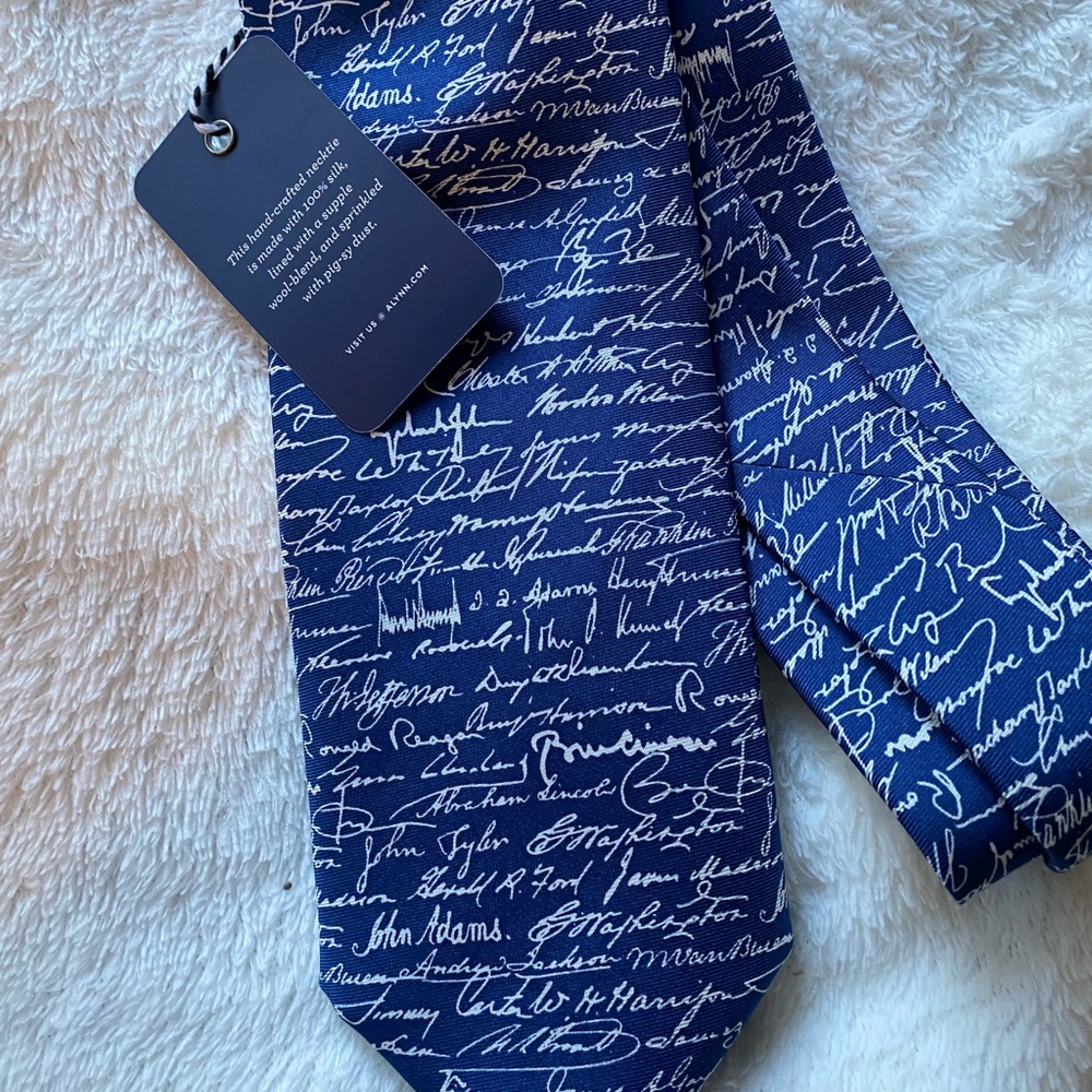 Men's 100% silk tie. Brand new with tag